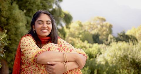 Indian Woman Enjoying Nature in Traditional Wear Smiling Peacefully
