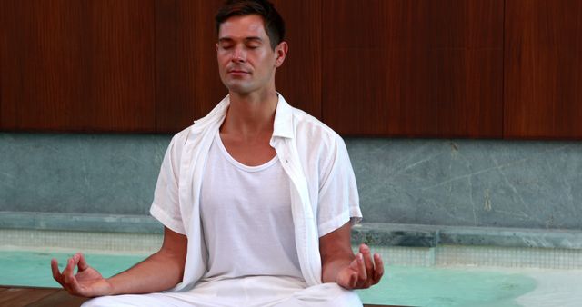 Man Meditating Indoors Practicing Mindfulness in Yoga Pose - Download Free Stock Images Pikwizard.com