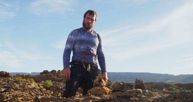 Man Standing on Rocky Terrain with Clear Sky - Download Free Stock Images Pikwizard.com