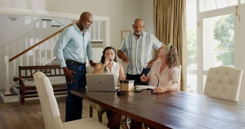 Diverse Seniors Collaborative Planning at Home Over Coffee