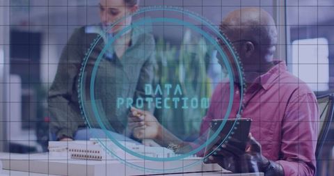 Business professionals discussing building model with data protection concept