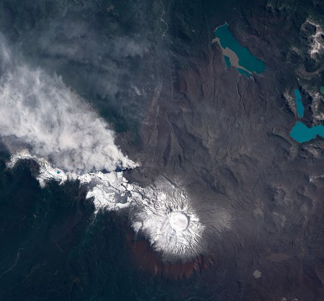 This image captures the eruption of the Puyehue-Cordón Caulle Volcano in Chile during December 2011, showing volcanic ash and snow on the surface. It illustrates the impact of volcanic eruptions on the environment, highlighting the natural interactions between volcanic activity and snow. Ideal for use in educational materials, scientific research, and nature documentaries focusing on geology, volcanology, and environmental science.
