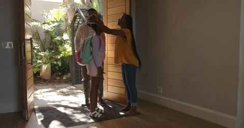 Parents welcoming daughter home with hugs and love