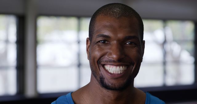 Smiling Man in Gym Wearing Blue Tank Top - Download Free Stock Images Pikwizard.com