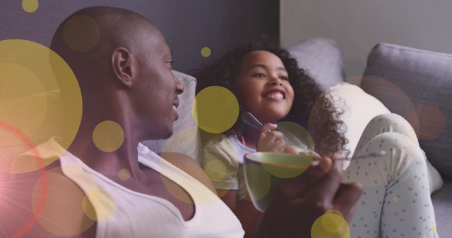 Father and Daughter Smiling, Bonding Together on Couch with Lens Flare Effect - Download Free Stock Images Pikwizard.com