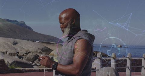 African American Middle-Aged Man Using Smartphone at Beach with Digital UI Overlay