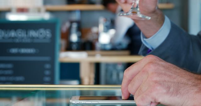 Businessman Using Smartphone while Drinking Coffee in Modern Cafe - Download Free Stock Images Pikwizard.com