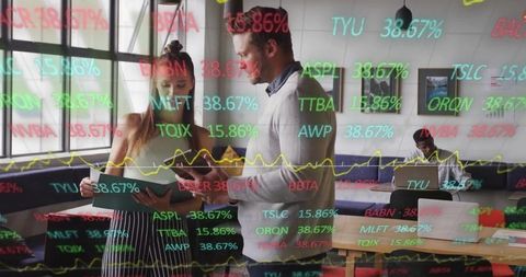 Analyzing Financial Data on LED Display in Modern Office