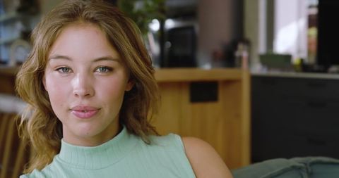 Young Woman Relaxing in Contemporary Minimalist Living Room