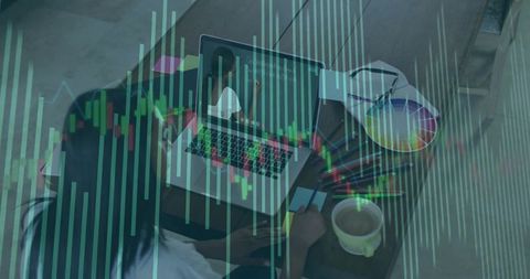 Woman Scanning Stock Market Data with Laptop in Home Office