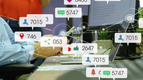 Office Worker Engaged with Social Media Notifications on Cellphone