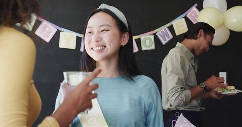 Joyful Baby Shower Celebration Among Diverse Colleagues