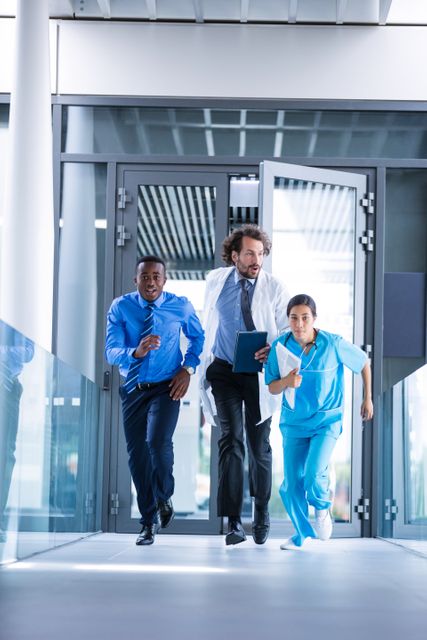 Businessman, Doctor, and Nurse Running in Hospital Corridor During Emergency - Download Free Stock Photos Pikwizard.com