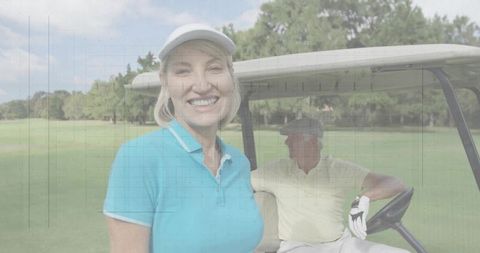 Mature Woman Enjoying Golfing on Green Fairway