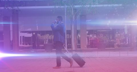 Businessman Walking with Suitcase on Urban Street
