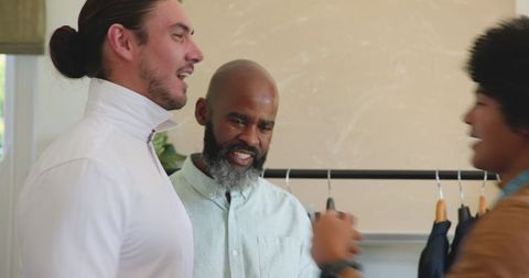 Friends preparing wardrobe for wedding celebration