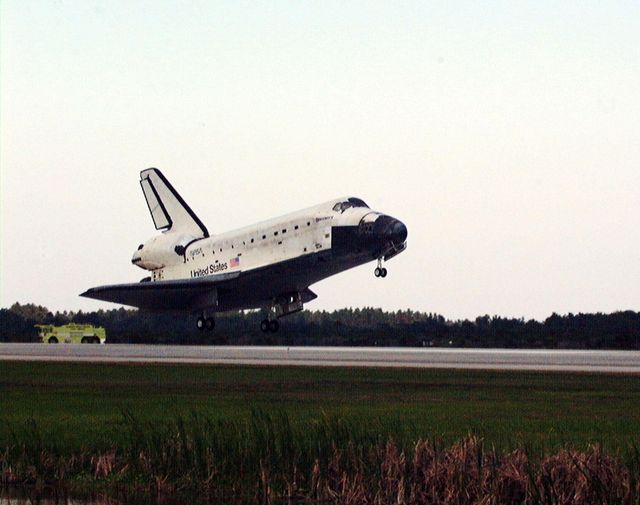 Orbiter Discovery completes STS-91 mission landing at Kennedy Space Center on June 12, 1998. Doc suggestions: Use for articles or projects related to space shuttle missions, NASA achievements, or historical space exploration milestones. Ideal for highlighting the success of the U.S. Space Shuttle program and its joint efforts with the Russian space station Mir.