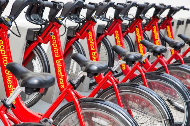 Row of Red Capital Bikeshare Bicycles at Rental Station - Download Free Stock Photos Pikwizard.com
