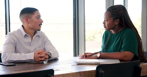 Colleagues in Professional Meeting Discussing Project Strategies