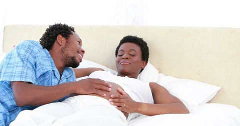 African american couple sharing intimate moment in bedroom