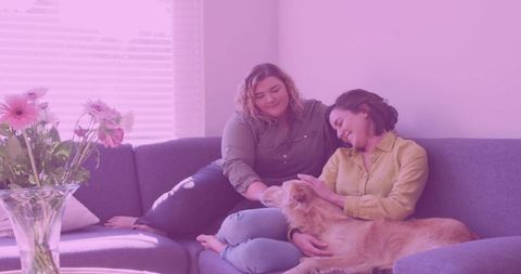 Joyful Friends Relaxing with Dog in Cozy Living Room