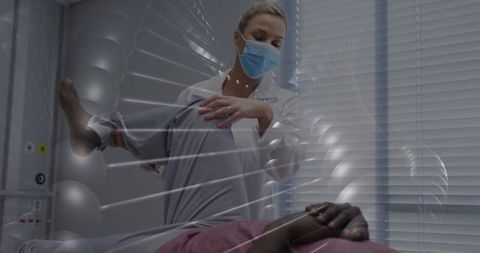 Therapist performing physiotherapy session in clinical environment