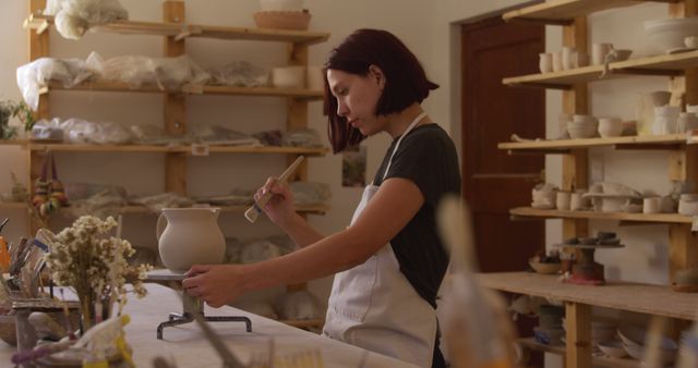 Female Potter Sculpting Clay Vase in Studio - Download Free Stock Images Pikwizard.com