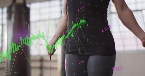 Data-driven workout: woman holding jump rope training with stock market chart overlay