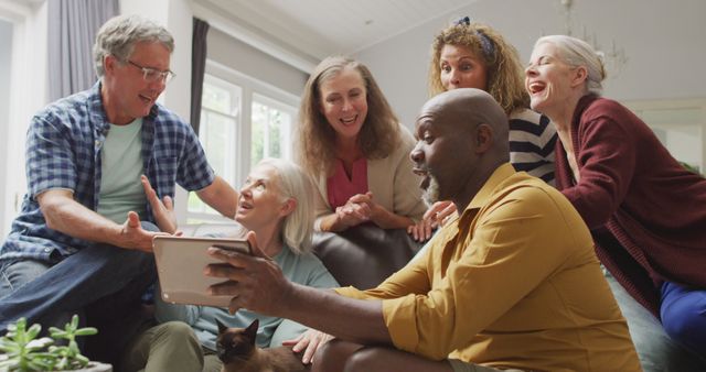 Diverse group of elderly friends enjoying each other's company indoors - Download Free Stock Images Pikwizard.com