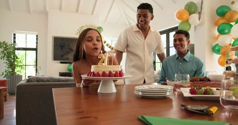 Joyful Birthday Celebration with Multiracial Friends Enjoying Cake