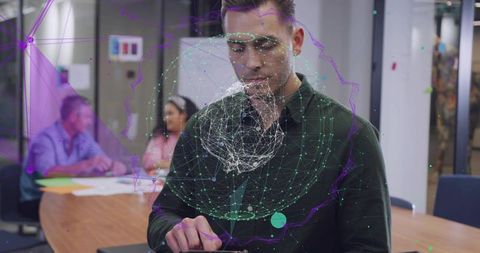 Presenting business professional interacting with holographic network on tablet in meeting