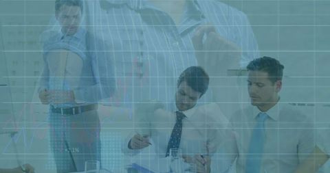 Business Professionals Analyzing Data with Innovation at Corporate Meeting