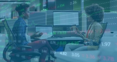 Collaborative Team Meeting Analyzing Market Trends in Modern Office