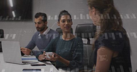Multicultural Team Discussing Data Dashboard During Boardroom Meeting