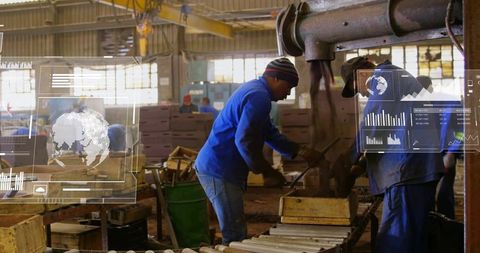 Factory workers operating conveyor and press with augmented reality hud data overlay