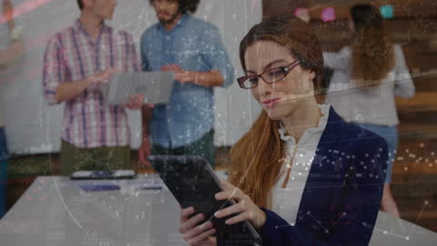 Businesswoman Analyzing Data on Tablet with Colleagues Collaborating