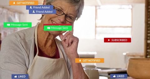 Senior artisan with ceramic bowl amongst virtual notifications