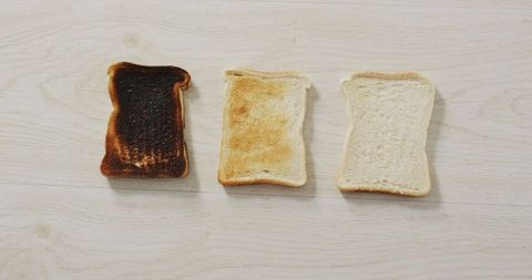 Variety of Toasts on Wooden Surface Depicting Cooking Stages