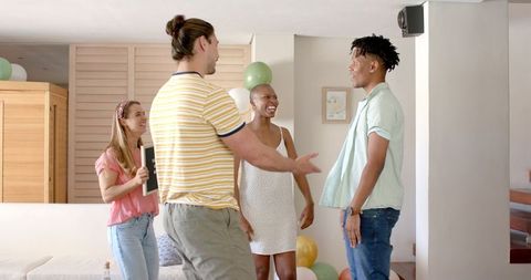 Friends Engaging at Lively Home Party Celebration