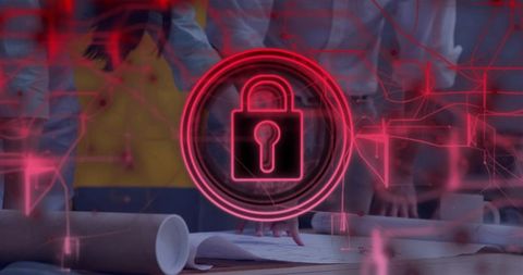 Team analyzing blueprints with neon padlock overlay representing cybersecurity protection