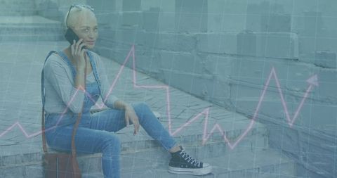 Biracial Woman Communicating on Smartphone with Data Graphics