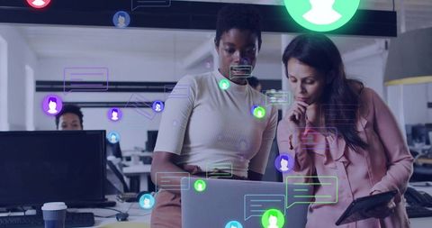 Coworkers Collaborating on Digital Data in Modern Office Setting