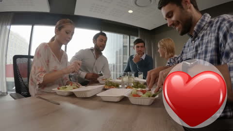 Group Enjoying Healthy Lunch with Playful Hearts Overlay
