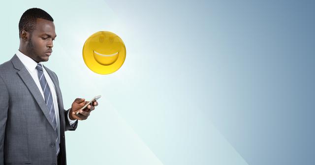Digital composite of Business man on phone with emoji and flare against blue background