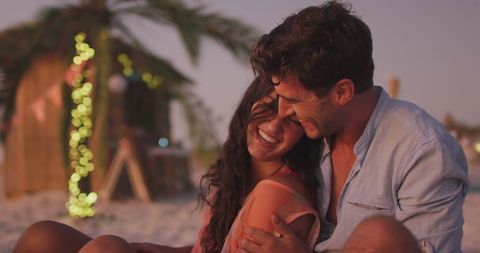 Romantic Couple Enjoying Sunset at Tropical Beach