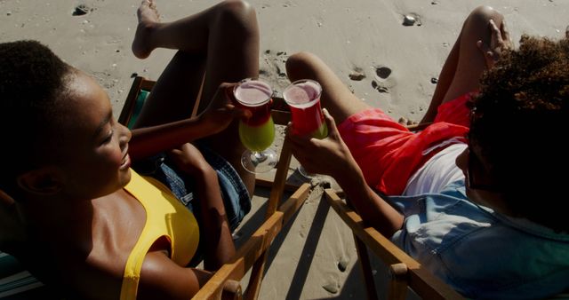 Friends Relaxing with Cocktails at Beach - Download Free Stock Images Pikwizard.com