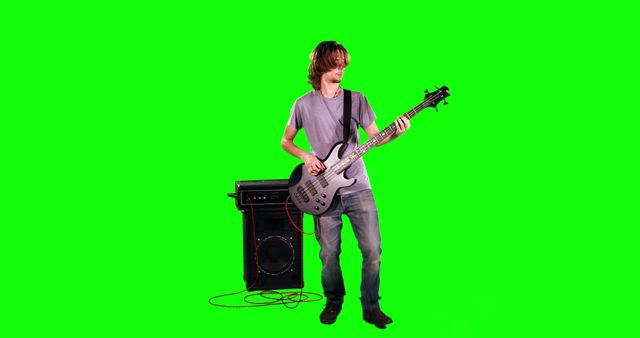 Young Man Playing Electric Bass Guitar in Studio - Download Free Stock Images Pikwizard.com