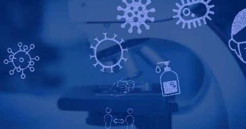Covid-19 pandemic symbols over microscope background