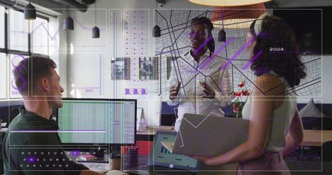 Diverse team collaborating over data dashboards and interactive maps in modern workspace