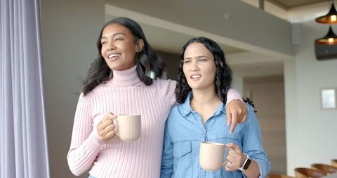 Diverse Friends Enjoying Coffee Together in Modern Home